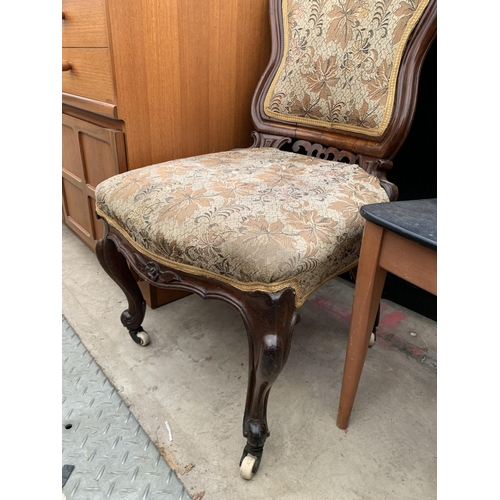 2615 - A VICTORIAN ROSEWOOD BOUDOIR CHAIR WITH FOLIATE BACK RAIL AND CABRIOLE FRONT LEGS