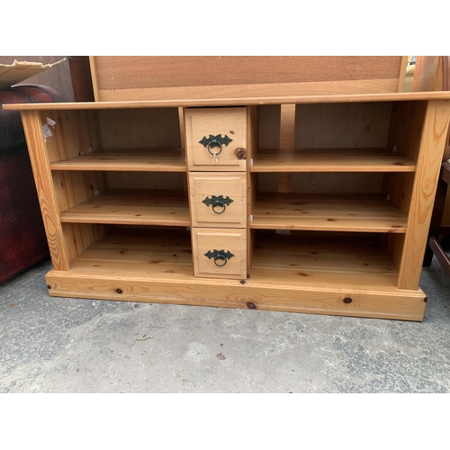 2663 - A PINE ENTERTAINMENT UNIT WITH THREE CENTRAL DRAWERS, 49.5