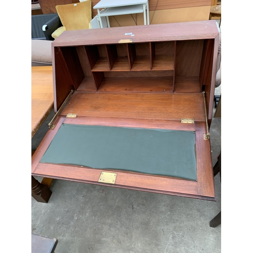 2720 - A MAHOGANY BUREAU WITH THREE DRAWERS HAVING PORCELAIN KNOBS, 36