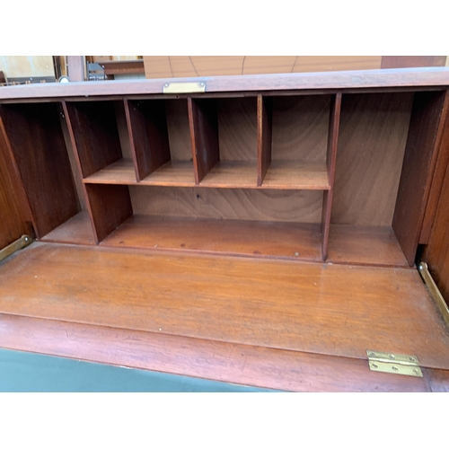 2720 - A MAHOGANY BUREAU WITH THREE DRAWERS HAVING PORCELAIN KNOBS, 36