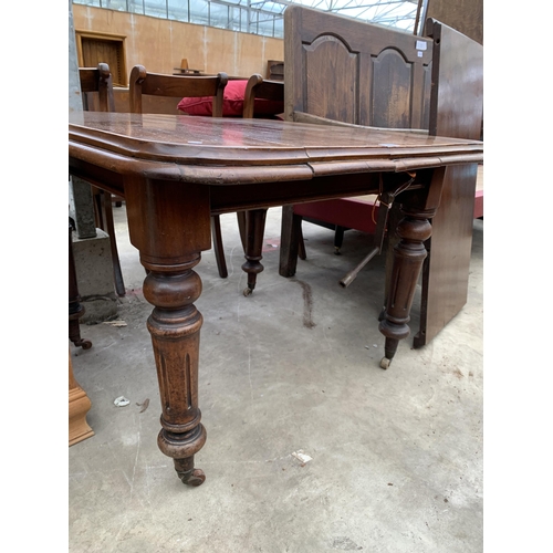 2724 - A VICTORIAN MAHOGANY WIND OUT DINING TABLE ON TURNED AND FLUTED LEGS, 38