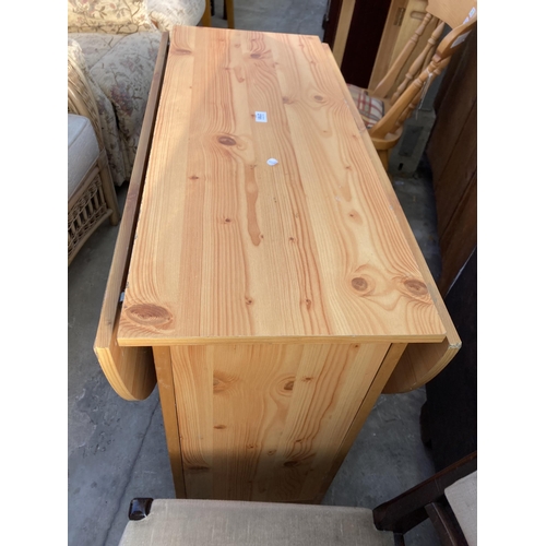 2781 - A PINE EFFECT DROP LEAF KITCHEN TABLE