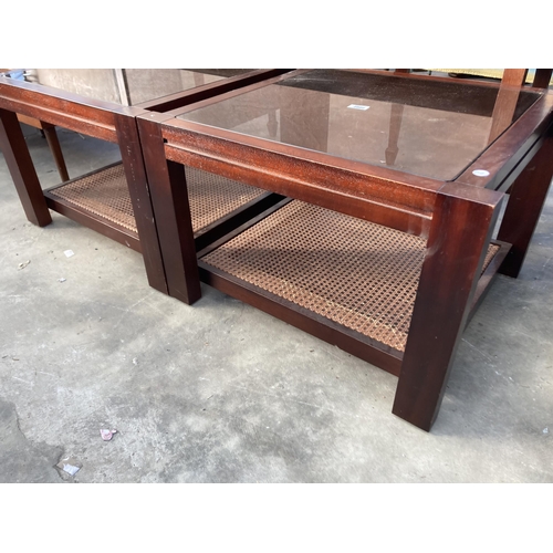 2800 - A PAIR OF LAMP TABLES WITH GLASS TOPS AND CANE UNDER SHELF, 25.5