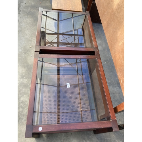 2800 - A PAIR OF LAMP TABLES WITH GLASS TOPS AND CANE UNDER SHELF, 25.5