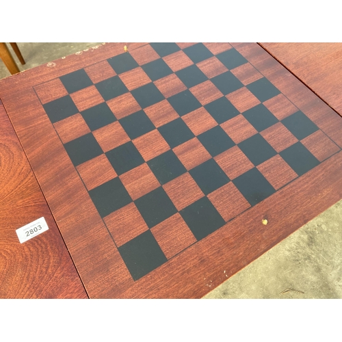 2803 - A COFFEE/GAMES TABLE ON CABRIOLE LEGS