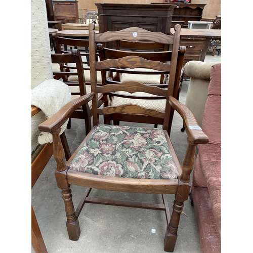 2821 - A TEAK ARMCHAIR AND AN OAK LADDERBACK CARVER DINING CHAIR