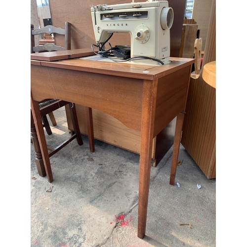 2821 - A TEAK ARMCHAIR AND AN OAK LADDERBACK CARVER DINING CHAIR