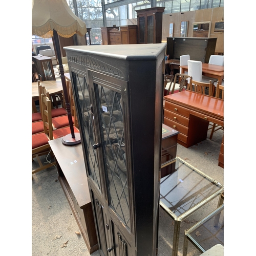 2822 - AN OAK CORNER CUPBOARD WITH GLAZED AND LEADED UPPER PORTION