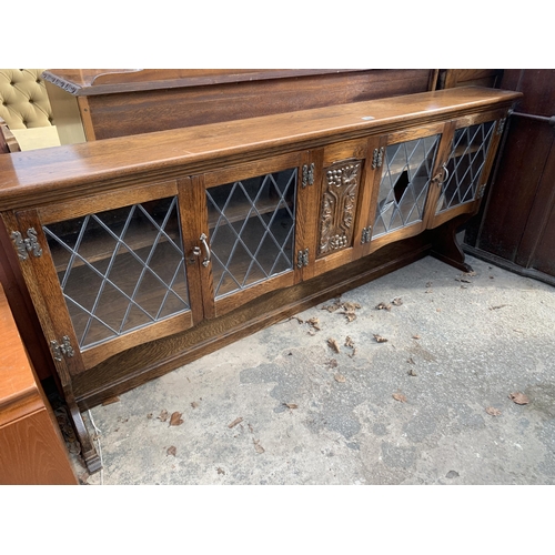 2832 - AN OAK GLAZED AND LEADED DRESSER BACK, 73