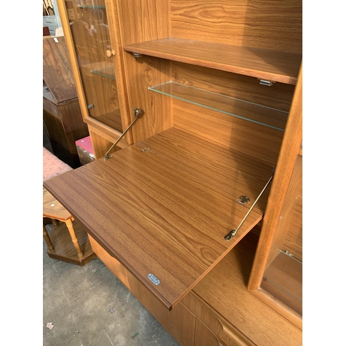 2864 - A RETRO TEAK LOUNGE COCKTAIL UNIT WITH GLAZED DISPLAY CUPBOARD, 70