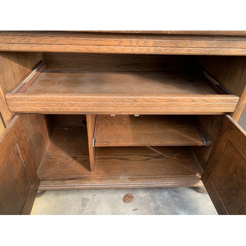 2873 - AN OAK STAND WITH ADJUSTABLE SWIVEL TOP