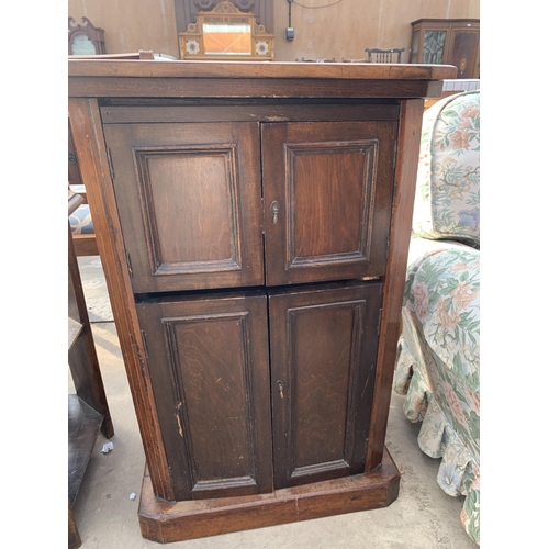 2875 - A VICTORIAN WALNUT AND BEECH FOUR DOOR CUPBOARD AND AND OAK THREE TIER OCCASIONAL TABLE