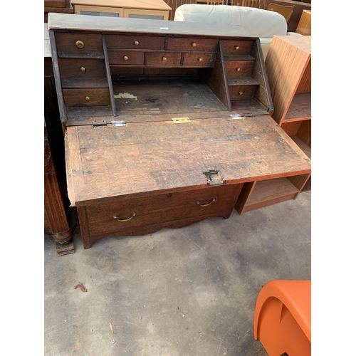 2890 - AN OAK GEORGE III BUREAU WITH FITTED INTERIOR AND THREE DRAWERS TO BASE, 37