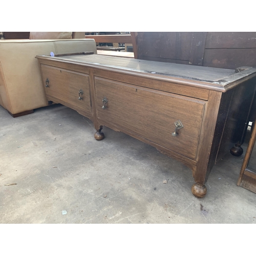 2893 - AN EARLY 20TH CENTURY OAK TWO DRAWER WARDROBE BASE, 61