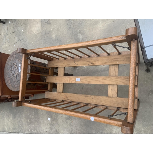 3049 - A MID 20TH CENTURY OAK FOLDING CRIB