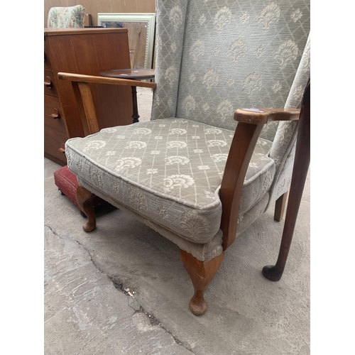 3059 - A WINGED FIRESIDE CHAIR ON FRONT CABRIOLE LEGS