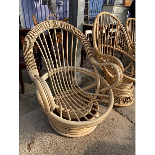 3091 - THREE BAMBOO AND WICKER SWIVEL CHAIRS