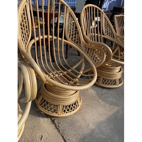 3091 - THREE BAMBOO AND WICKER SWIVEL CHAIRS