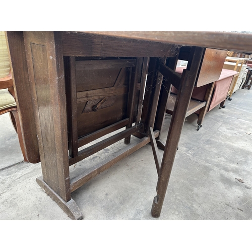 3134 - A MID 20TH CENTURY OAK DROP LEAF TABLE