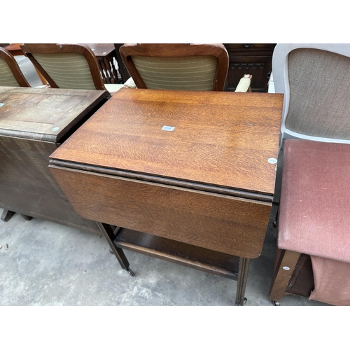 3135 - A MID 20TH CENTURY OAK TWO-TIER TROLLEY AND PADDED BLANKET CHEST