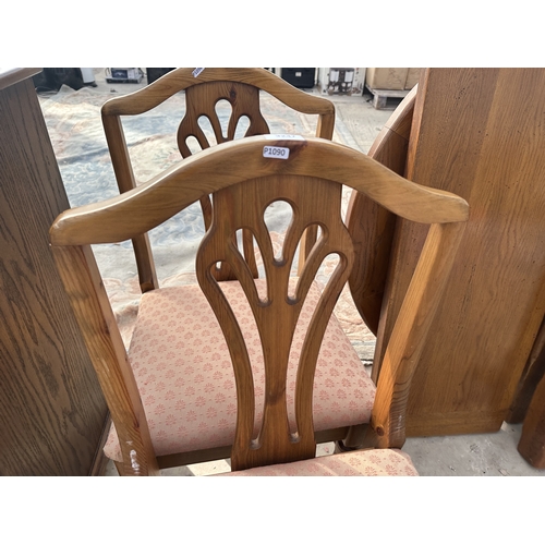 3247 - AN OAK EXTENDING DIDNING TABLE WITH TWO LEAVES AND TWO DINING CHAIRS