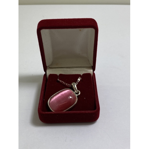 651 - A BOXED MARKED SILVER NECKLACE WITH A PINK STONE PENDANT