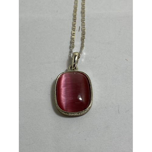 651 - A BOXED MARKED SILVER NECKLACE WITH A PINK STONE PENDANT