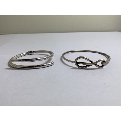 655 - TWO MARKED SILVER BANGLES