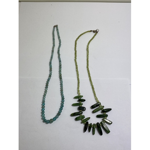 656 - TWO BEADED NECKLACES WITH MARKED SILVER CLASPS