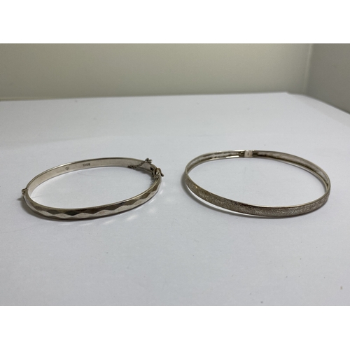 663 - TWO MARKED SILVER BANGLES