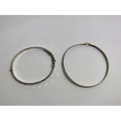 663 - TWO MARKED SILVER BANGLES