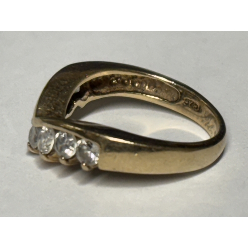 519 - A MARKED 9 CARAT GOLD WISHBONE RING WITH SEVEN STONES SIZE K