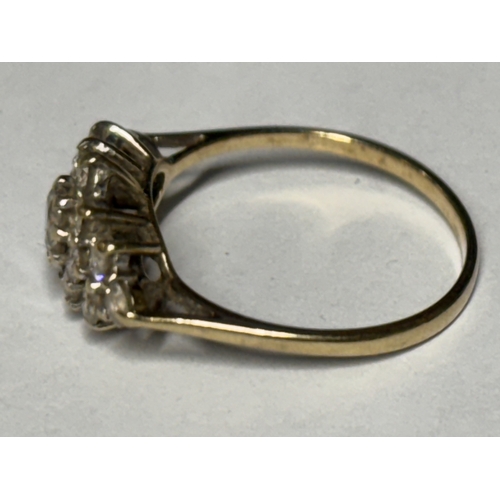 522 - A MARKED 9 CARAT GOLD RING WITH FIFTEEN CLEAR STONES SIZE O