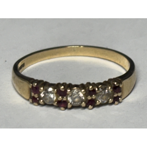 525 - A MARKED 9 CARAT GOLD RING WITH RUBIES AND DIAMONDS SIZE O/P