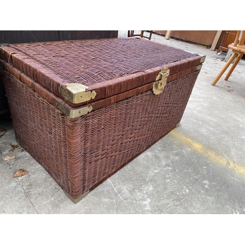 2715 - A WICKER BLANKET CHEST WITH APPLIED BRASS DECORATION, 35