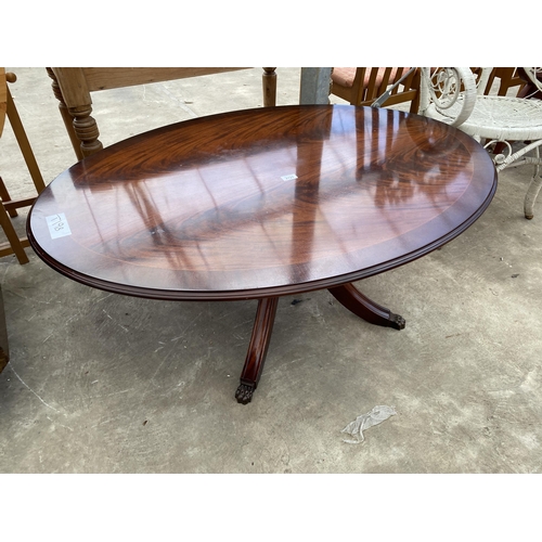 2721 - AN OVAL MAHOGANY AND CROSSBANDED COFFEE TABLE ON PEDESTAL BASE, 48