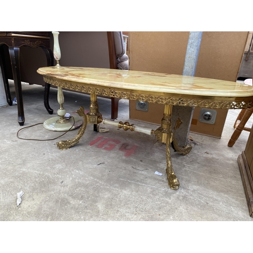 2724 - AN OVAL ONYX COFFEE TABLE ON GILT METAL BASE, 48