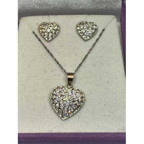 546 - A SILVER SENSATIONS MARKED SILVER NECKLACE AND EARRING SET WITH HEARTS ENCRUSTED WITH CLAER STONES