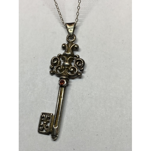 560 - A HEAVY MARKED SILVER KEY PENDANT WITH CHAIN IN A PRESENTATION BOX