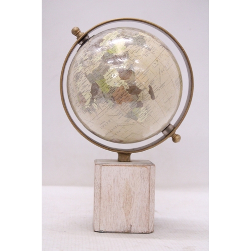 291 - A WORLD GLOBE ON A WOODEN BASE, HEIGHT 25CM