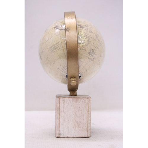 291 - A WORLD GLOBE ON A WOODEN BASE, HEIGHT 25CM