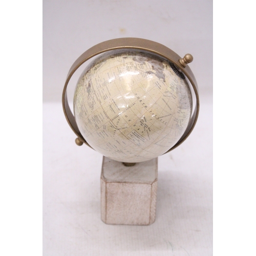 291 - A WORLD GLOBE ON A WOODEN BASE, HEIGHT 25CM