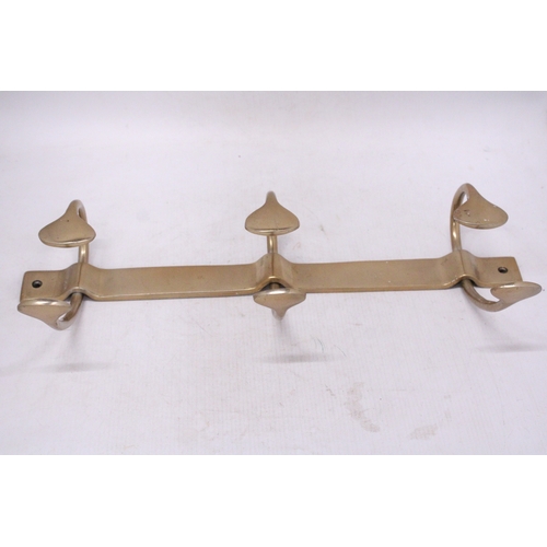 299 - A BRASS ART NOVEAU STYLE COAT RACK HANGER