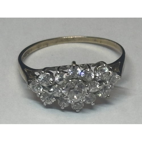 504 - A MARKED 9 CARAT GOLD RING WITH FIFTEEN CUBIC ZIRCONIAS IN A CLUSTER DESIGN SIZE Q GROSS WEIGHT 1.82... 