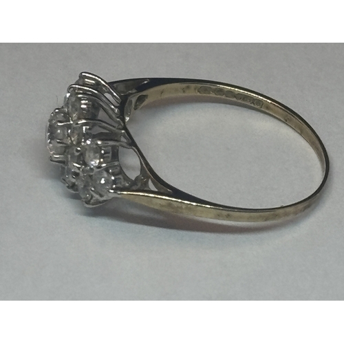 504 - A MARKED 9 CARAT GOLD RING WITH FIFTEEN CUBIC ZIRCONIAS IN A CLUSTER DESIGN SIZE Q GROSS WEIGHT 1.82... 