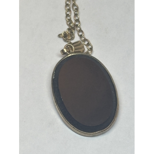 509 - A MARKED 9 CARAT GOLD NECKLACE WITH A9 CARAT GOLD AND ONYX PENDANT GROSS WEIGHT 3.12 GRAMS