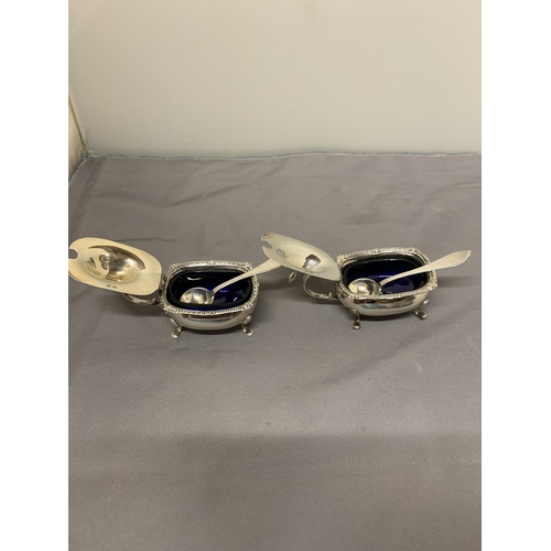 7 - A PAIR OF HALLMARKED BIRMINGHAM MUSTARD POTS WITH BLUE GLASS LINERS PLUS A PAIR OF HALLMARKED LONDON... 