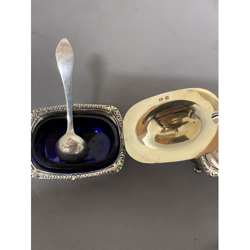 7 - A PAIR OF HALLMARKED BIRMINGHAM MUSTARD POTS WITH BLUE GLASS LINERS PLUS A PAIR OF HALLMARKED LONDON... 