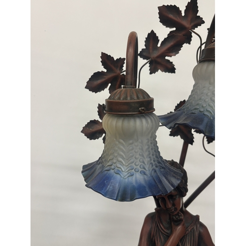17 - A LARGE TABLE LAMP WITH THREE GLASS LIGHT SHADES AND A LADY FIGURE TO THE BASE, HEIGHT APPROX 84CM