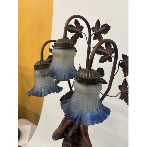 17 - A LARGE TABLE LAMP WITH THREE GLASS LIGHT SHADES AND A LADY FIGURE TO THE BASE, HEIGHT APPROX 84CM
